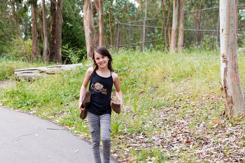 Young girl carrying wood