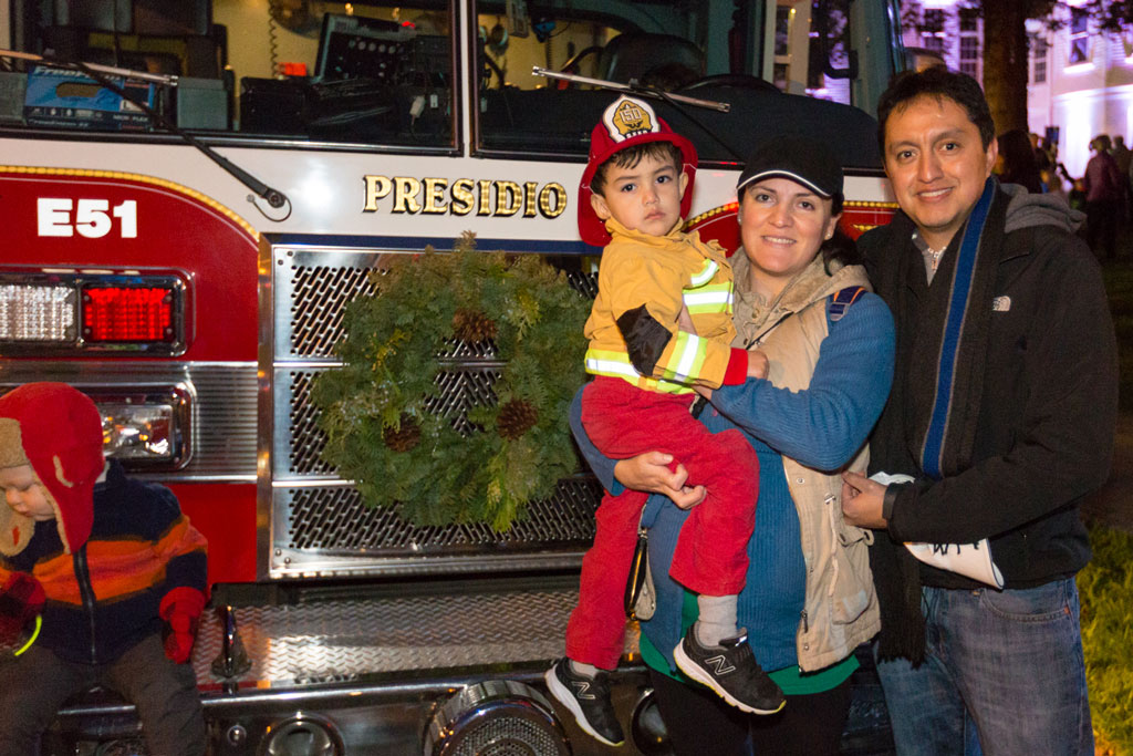 Family in front of fire truck