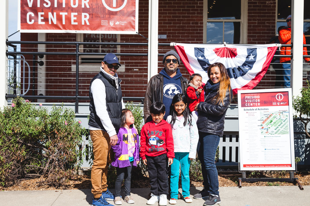 Group of adults and children in front of Presidio Visitor Center