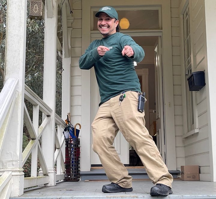 Presidio Trust staff member on stairs waving at the camera.