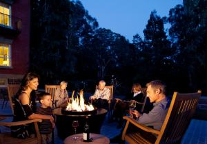 Five people sitting around the fire pit at the Inn. Photo by Paul Dyer.