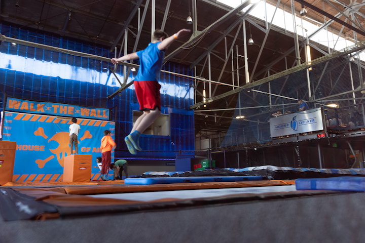 Kid jumping on a trampoline at the House of Air in the Presidio.