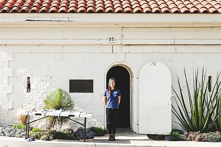 Exterior of the Powder Magazine which houses Andy Goldsworthy’s Tree Fall, with a docent standing in front.