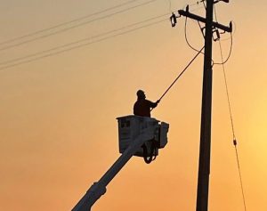 Presidio Trust High Voltage workers make a repair on a power line.