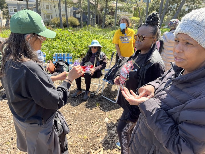 Three women from the Rafiki Coalition for Health and Wellness visit the Presidio.