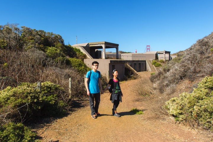 A man and woman walk near Battery Crosby.