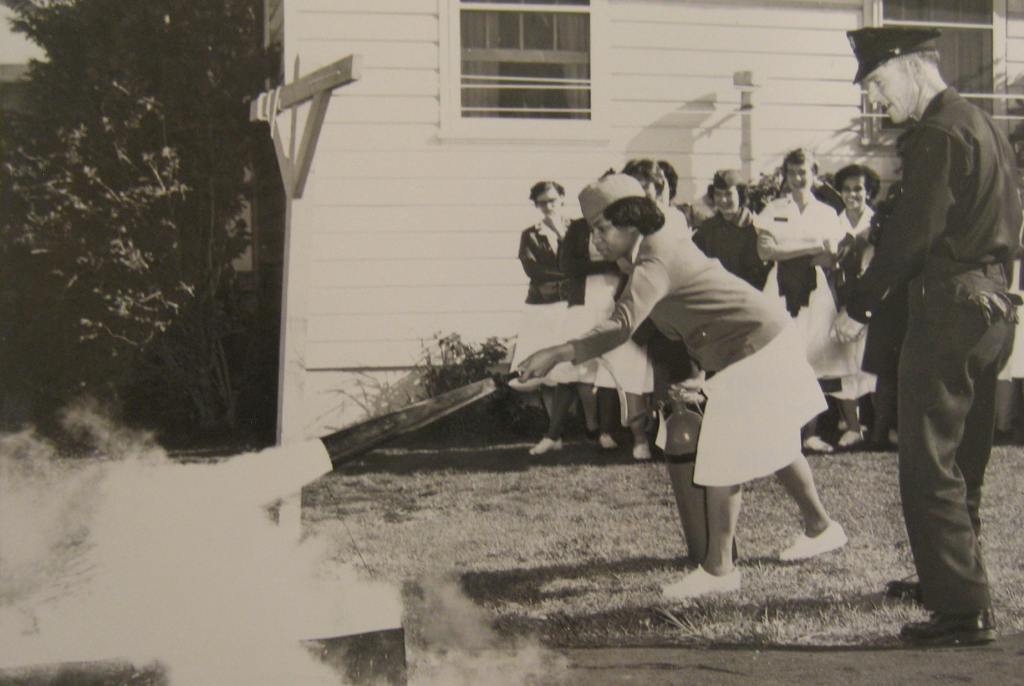 Nurses at Letterman Hospital take turns with the hose, putting fire out.