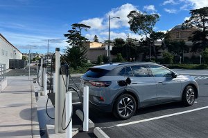 Car parked and plugged into an EV charging station at the Presidio.