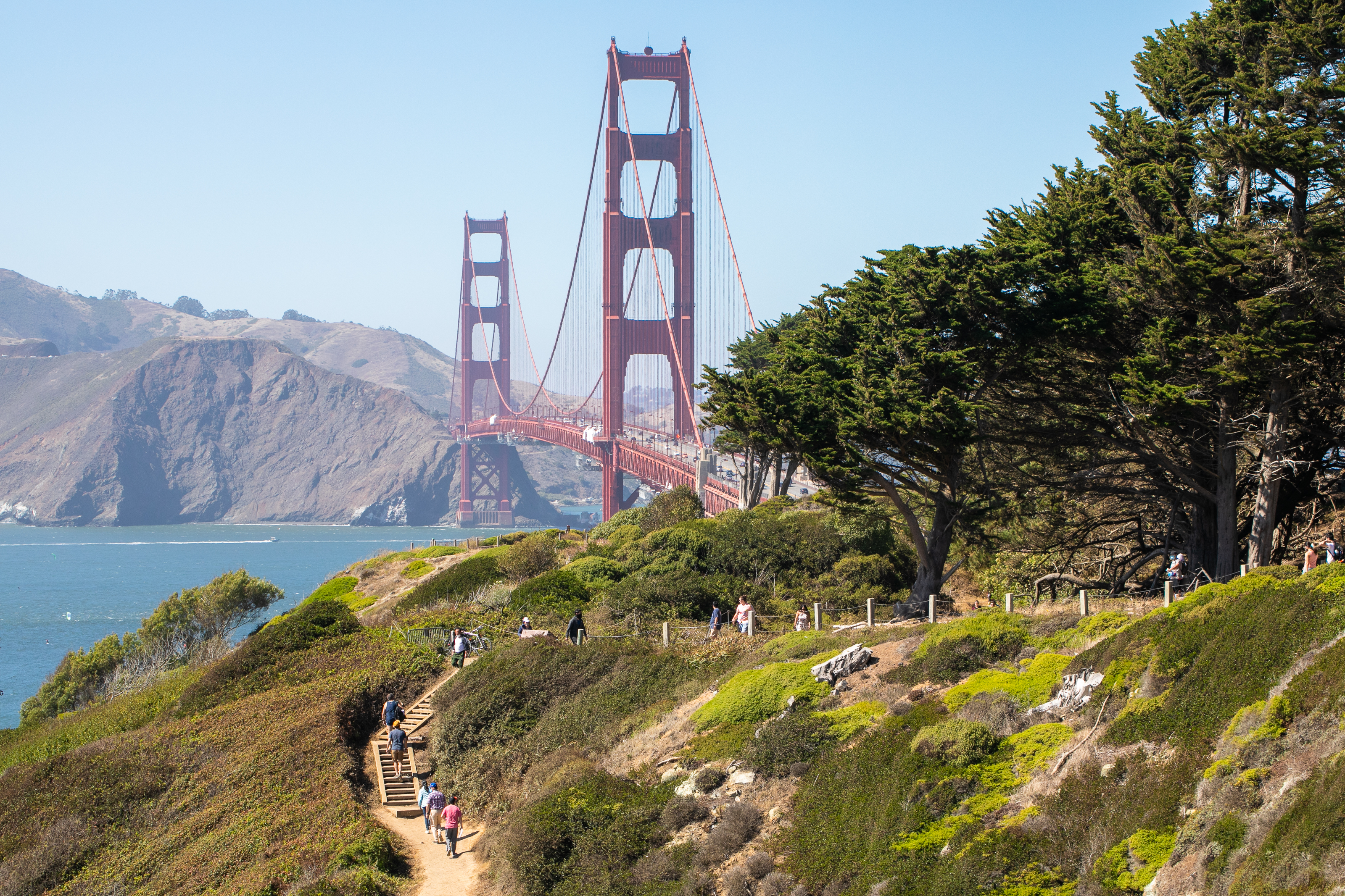 Group of people walking up the stairs of the Batteries to Bluffs trail