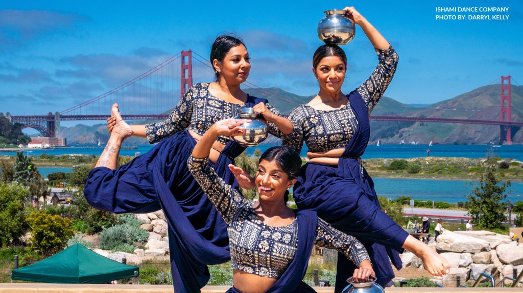 Three performers from Ishami Dance Company posing