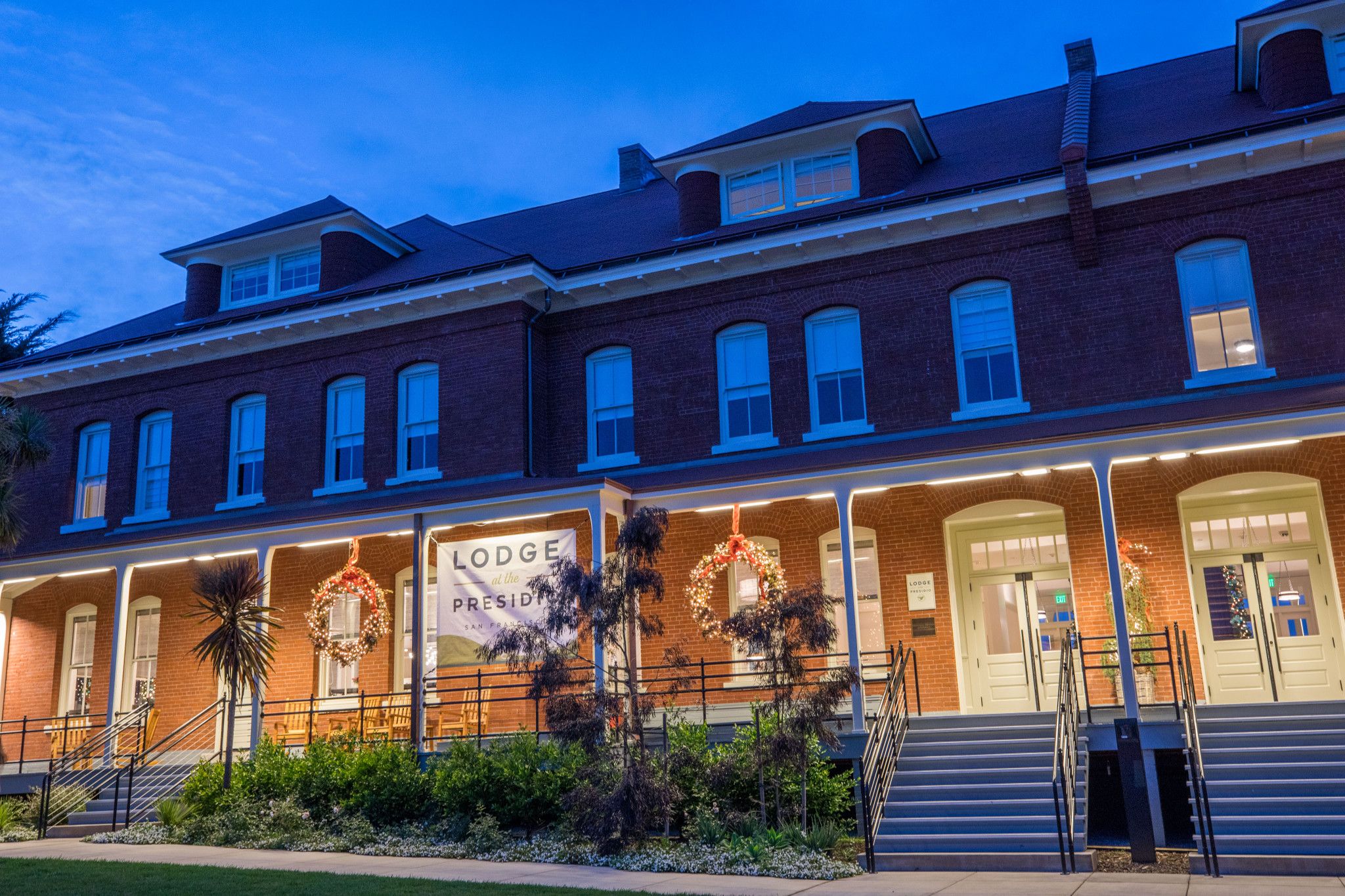 external shot of Presidio Lodge at night